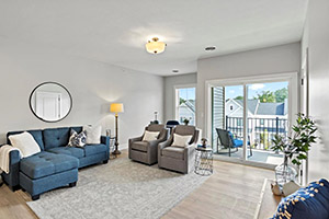 Edgewood Apartment Model Gallery photo showing living room and covered balcony